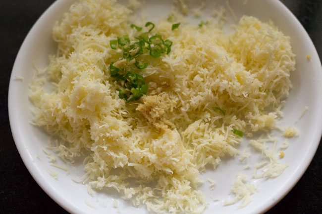 finely chopped green chilies added to grated cheese. 