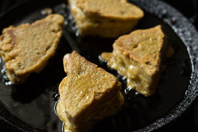 frying cheese bread pakora till golden in hot oil. 