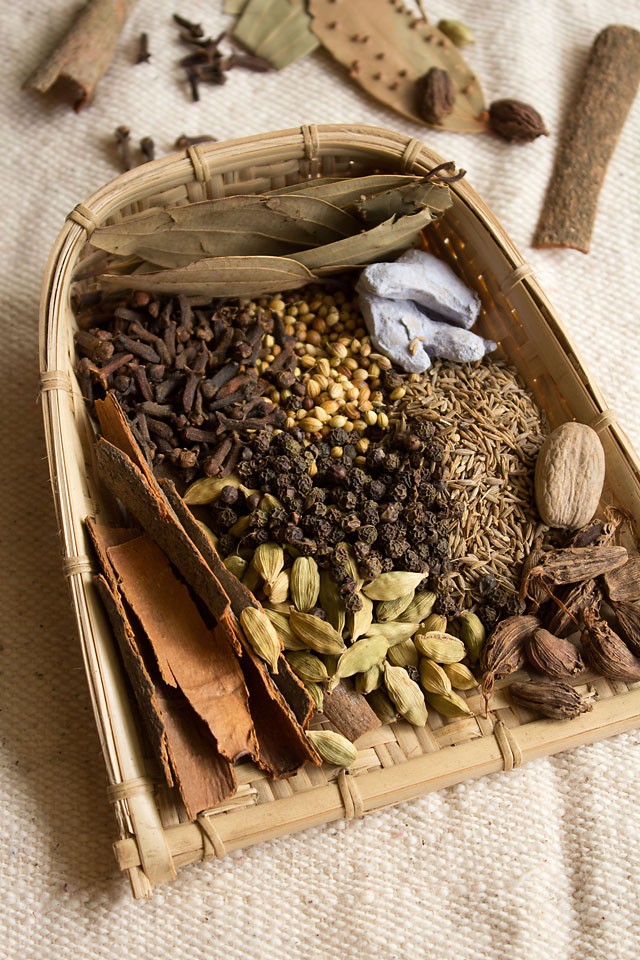 spices kept in a traditional indian basket.