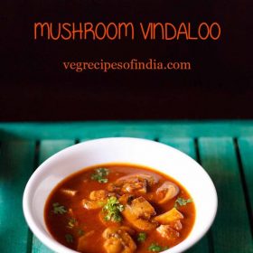 vindaloo recipe with mushrooms garnished with chopped coriander leaves and served in a white bowl on a green tray.