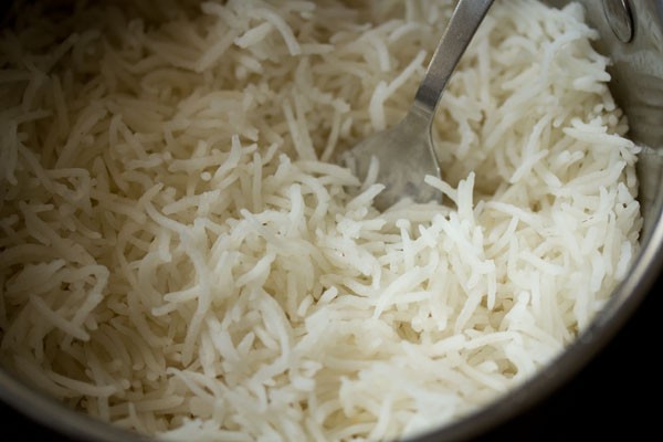 rice grains (chawal) cooked and fluffy. 