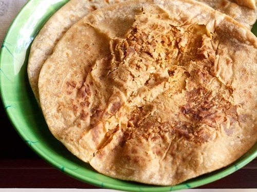 puran poli on a green plate.