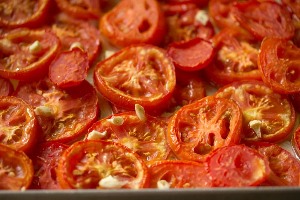roasted tomatoes have a golden tint, have shrunk considerably, and look somewhat dry.