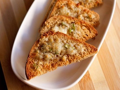 cheese chilli toast on white tray.