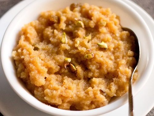 moong dal halwa served in a white bowl.