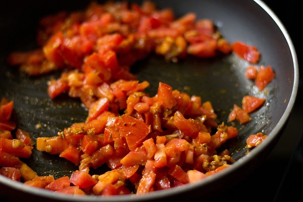 finely chopped tomatoes added to the pan. 