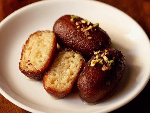 kala jamun on a white plate.