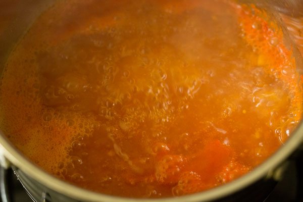 tomato broth simmering in the pan. 
