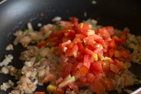 finely chopped tomatoes added to pan. 
