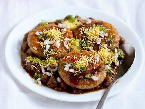 aloo tikki chole on a plate.