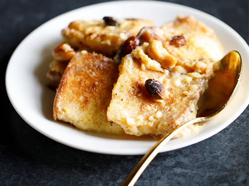 double ka meetha on a plate with spoon.