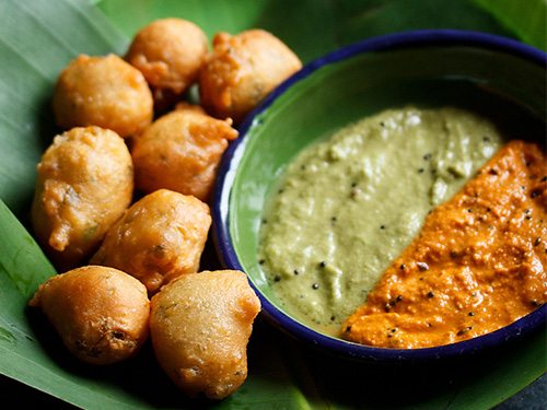 goli baje with two chutneys on a plate.