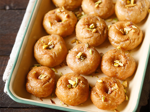 badusha arranged neatly on a tray.