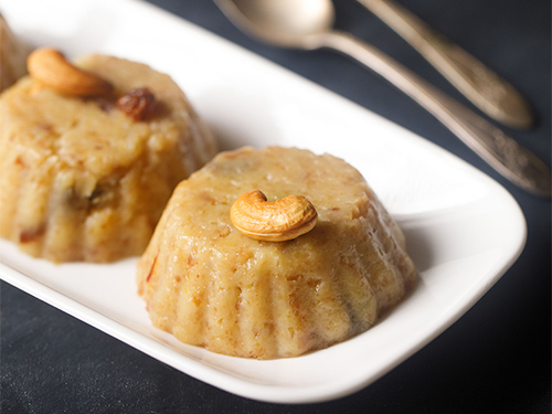 bread halwa on a white tray.