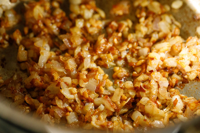 caramelized onions and garlic with deep golden hues in the skillet