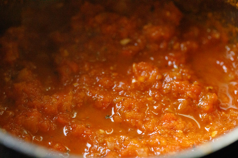 completed homemade marinara in skillet - has a slightly thick, crushed tomato looking consistency