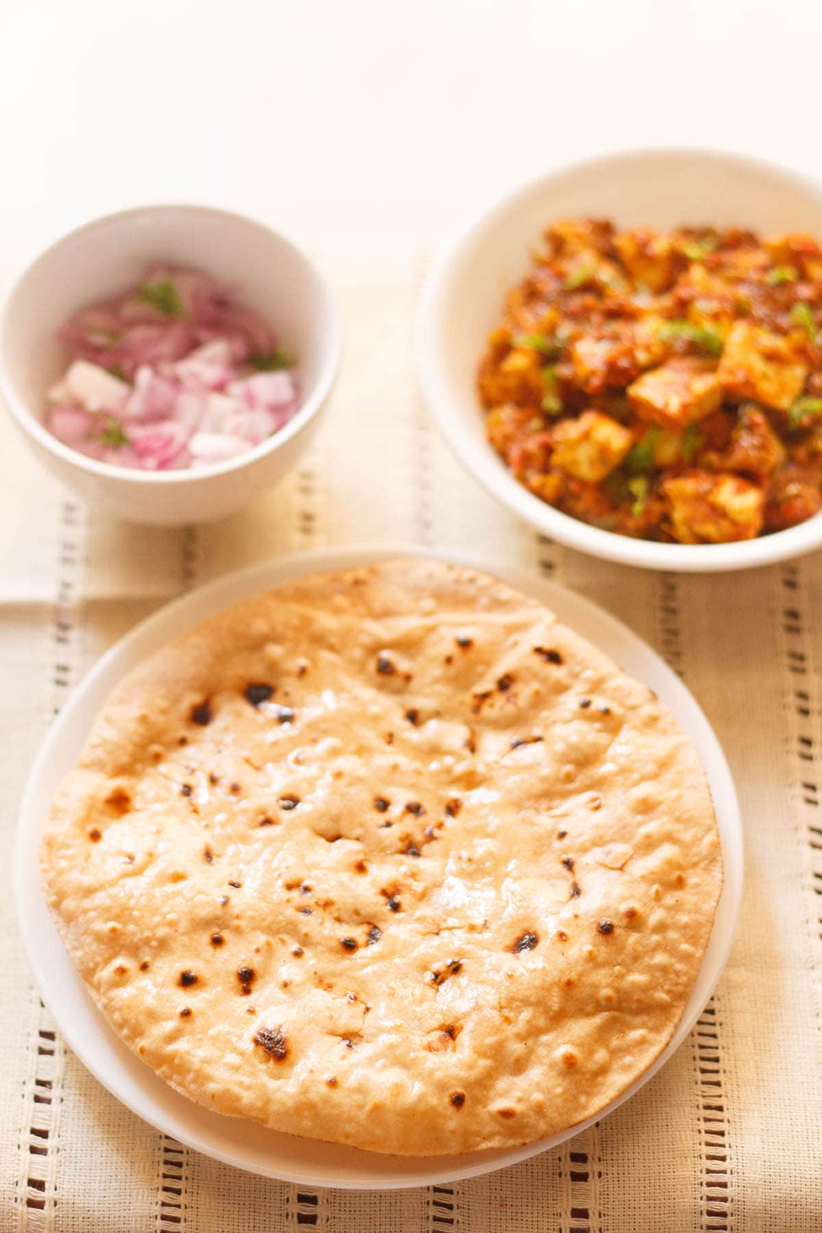 Indian iron tawa or pan to prepare chapati, roti on white