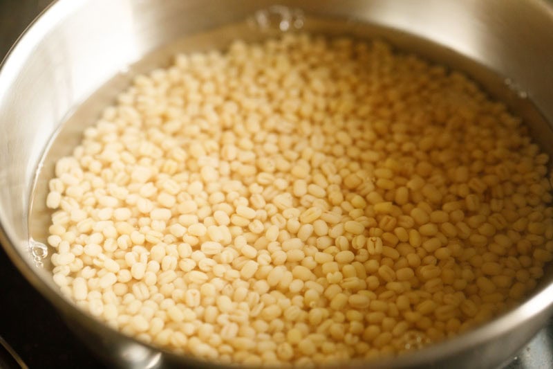 black gram and fenugreek seeds soaking in water.