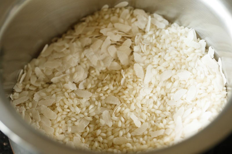 idli rice and thick flattened rice added in another bowl.