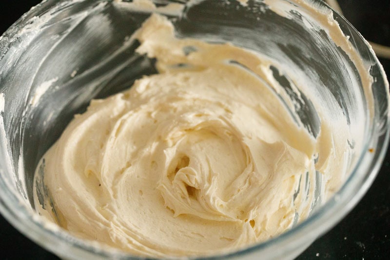 prepared buttercream frosting in bowl to make vanilla cupcakes.