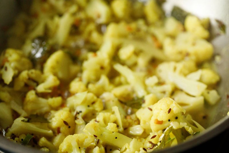 cauliflower florets almost cooked.