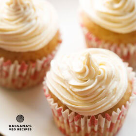 closeup image of three eggless cupcakes frosted with buttercream icing with text layovers.