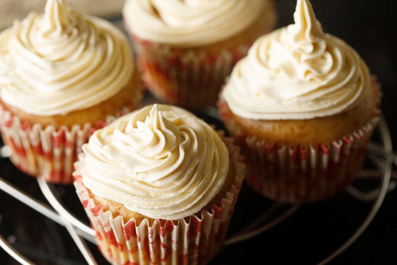 buttercream frosting piped on eggless cupcakes.