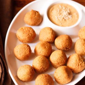 falafel served in a chip and dip platter with muhammara.