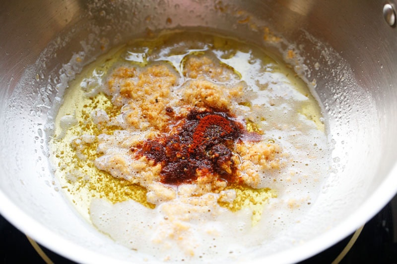 smoked paprika and ground black pepper added to golden fried garlic.