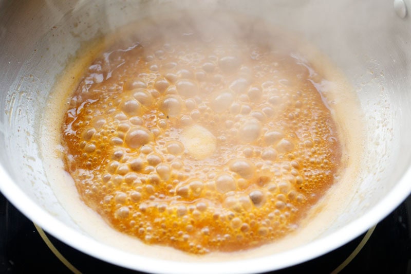 garlic butter sauce thickened and emulsified in pan.