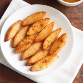 idli fry on a white plate.