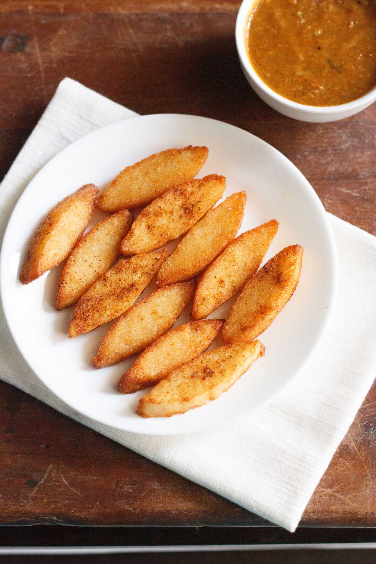 idli fry on a white plate.