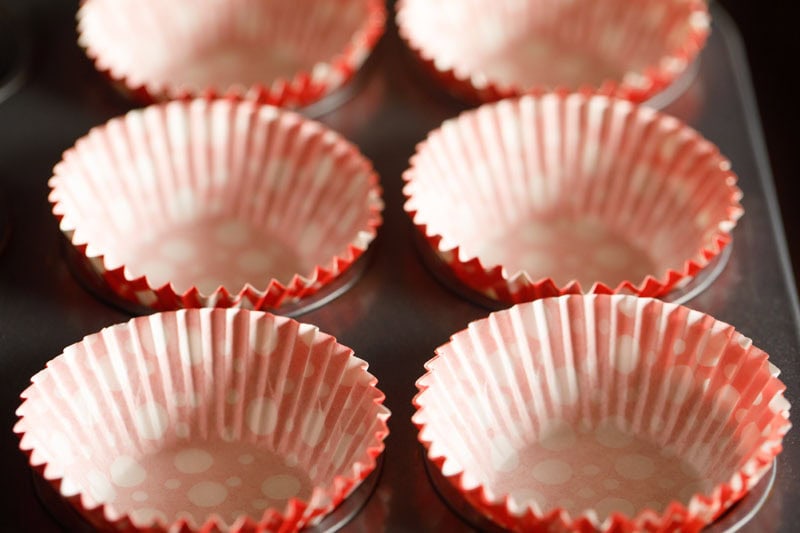 muffins or cupcake liners placed in cupcake pan moulds.