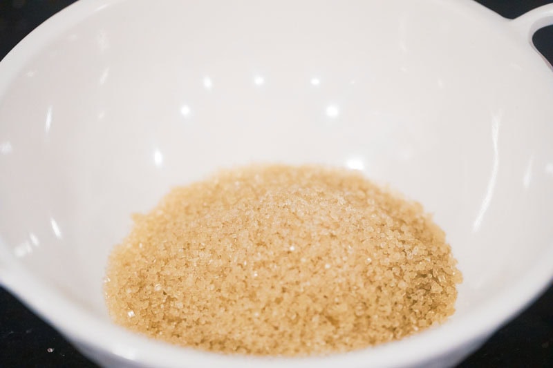 raw sugar added in a white bowl.