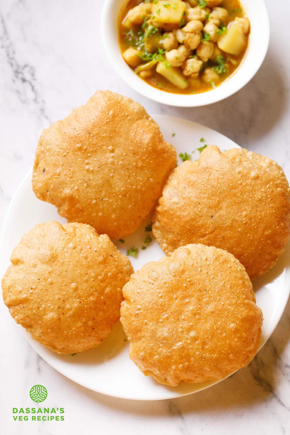 bedmi poori on a white plate.