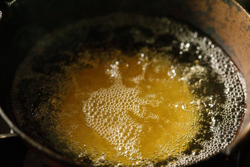 bedmi poori frying in oil.