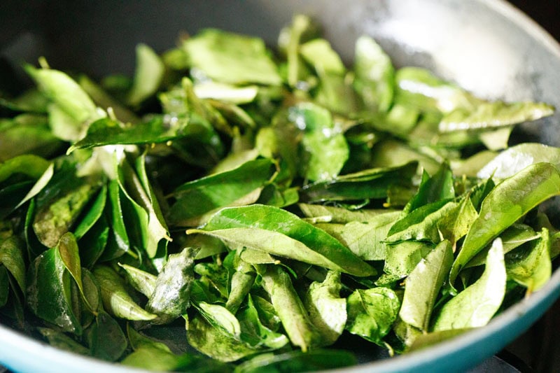 roasting curry leaves in pan or skillet.