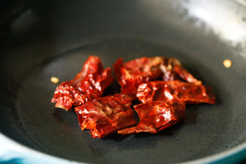 dry red chillies in skillet.