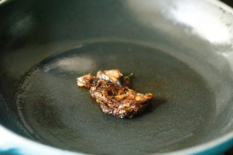 tamarind flattened and being cooked in the skillet.