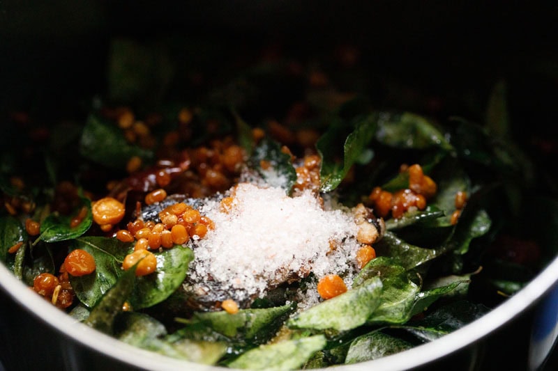 roasted ingredients with salt in a blender jar.