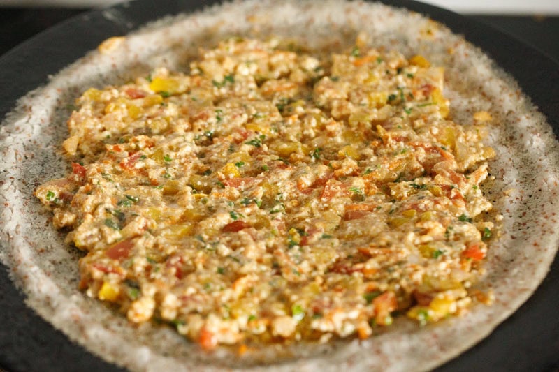 paneer mixed with vegetables and spread on the dosa.