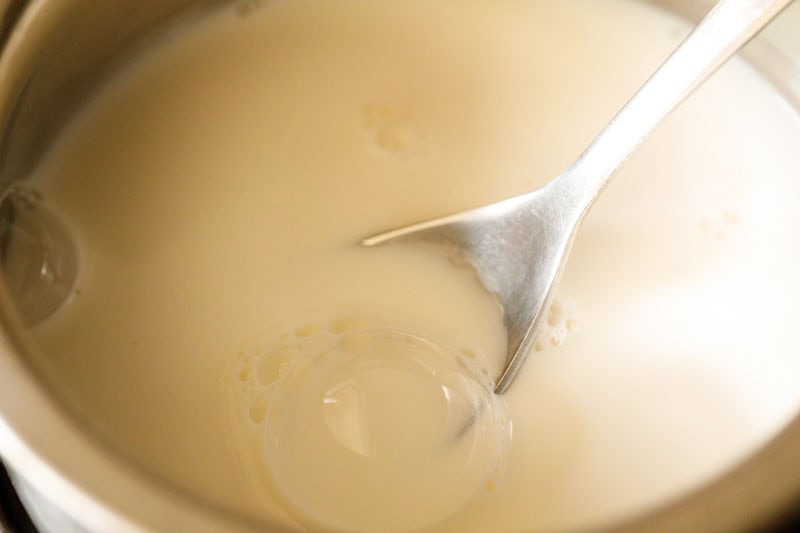 milk with spoon in a pan.