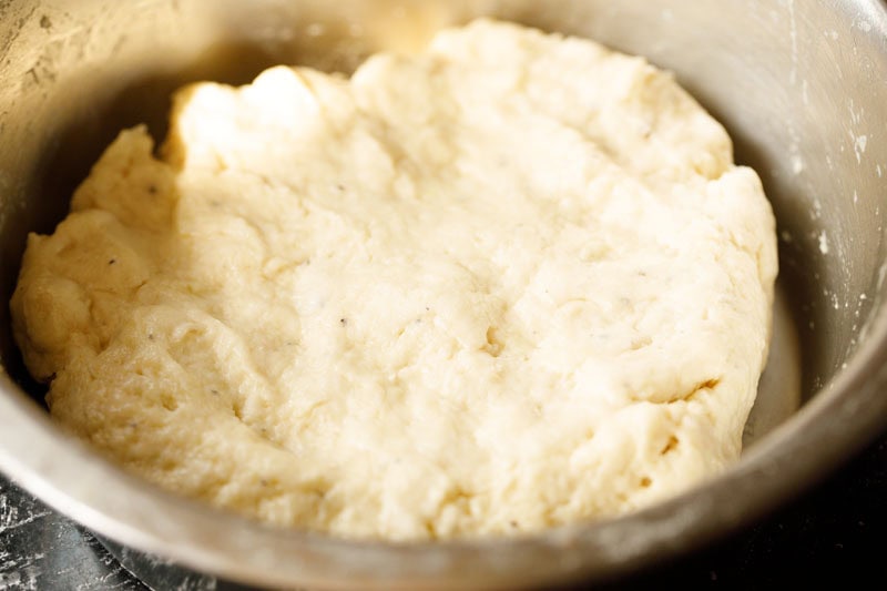 shirmal dough flattened with indents in bowl.