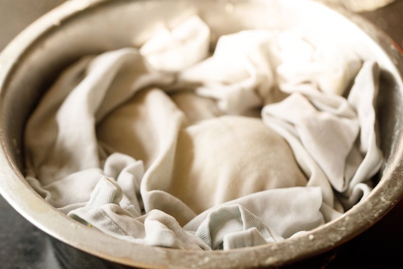 shirmal dough balls covered with moist kitchen napkin.