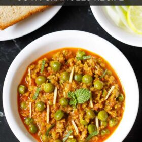 soya keema in a white bowl with bread and sliced onions, cucumber and lemon slice with text layovers.