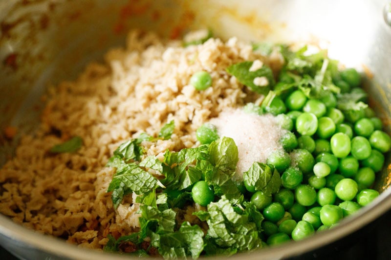 soya granules, green peas, chopped mint and salt in the pan.