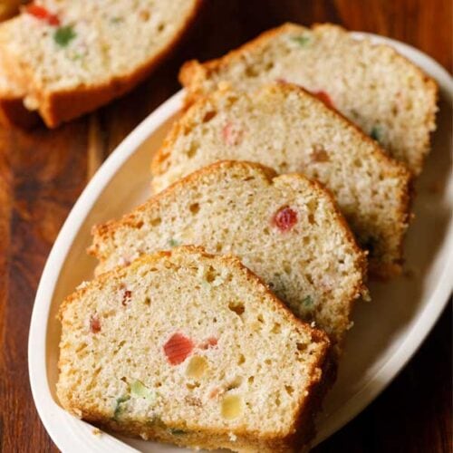 tutti frutti cake slices served on a white plate.