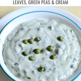 methi matar malai in a white bowl with a light blue rim with text layovers.