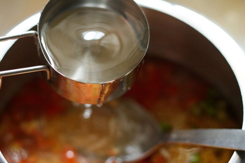 water being added in the pressure cooker.