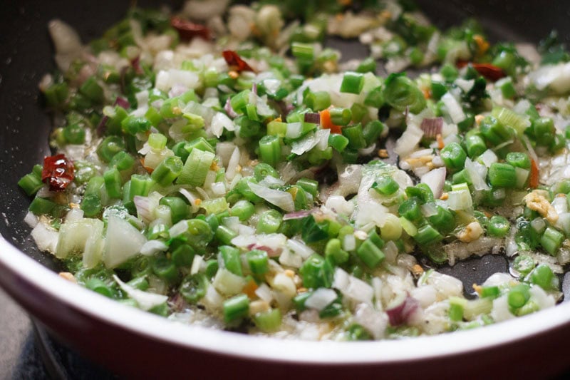 chopped spring onions and chopped french beans added to pan. 